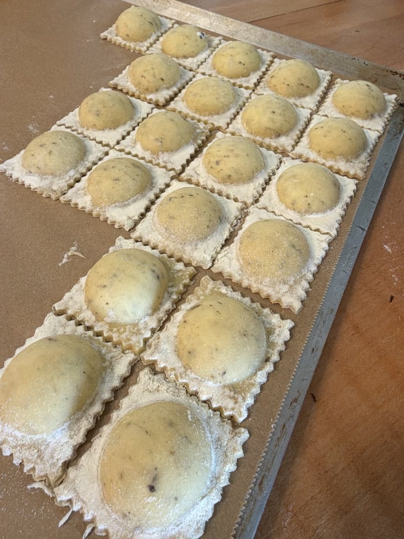 Fresh handmade ravioli on a tray